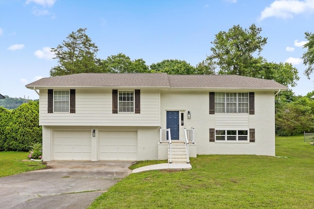 3554 Mountain Creek Rd, Chattanooga, TN 37415 - raised ranch with an attached garage, a front yard, concrete driveway, and brick siding