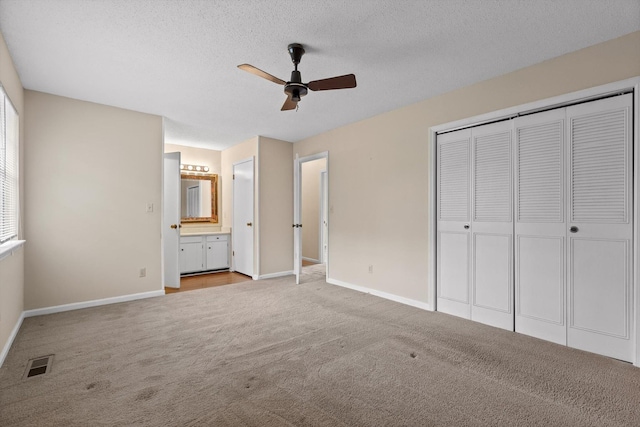 3554 Mountain Creek Rd, Chattanooga, TN 37415 - unfurnished bedroom with carpet, baseboards, a closet, a textured ceiling, and ceiling fan