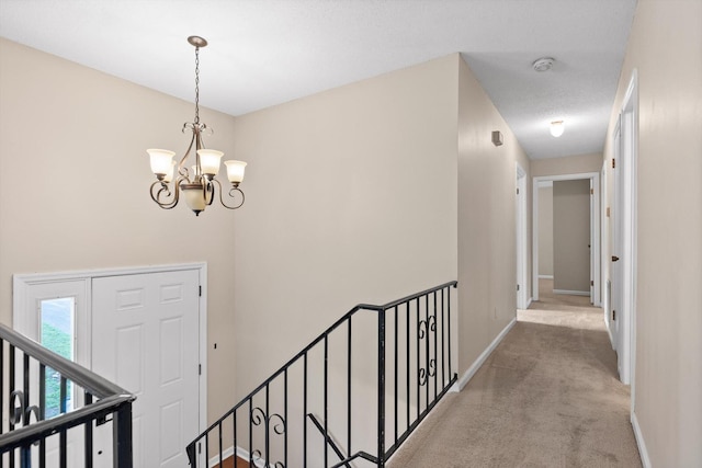 3554 Mountain Creek Rd, Chattanooga, TN 37415 - hall with an upstairs landing, carpet flooring, a chandelier, and baseboards