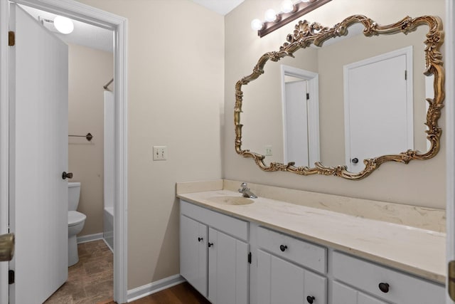 3554 Mountain Creek Rd, Chattanooga, TN 37415 - bathroom featuring vanity, toilet, bathtub / shower combination, and baseboards