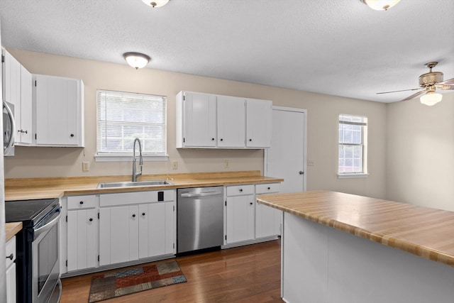 3554 Mountain Creek Rd, Chattanooga, TN 37415 - kitchen with appliances with stainless steel finishes, a sink, a textured ceiling, dark wood finished floors, and a ceiling fan