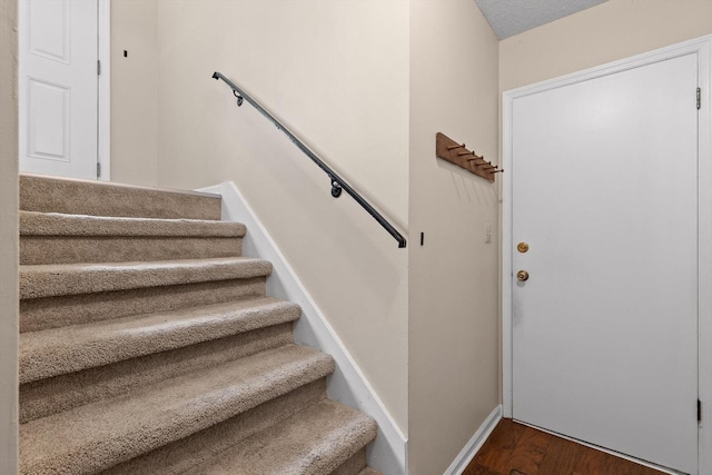 3554 Mountain Creek Rd, Chattanooga, TN 37415 - stairs featuring wood finished floors and baseboards
