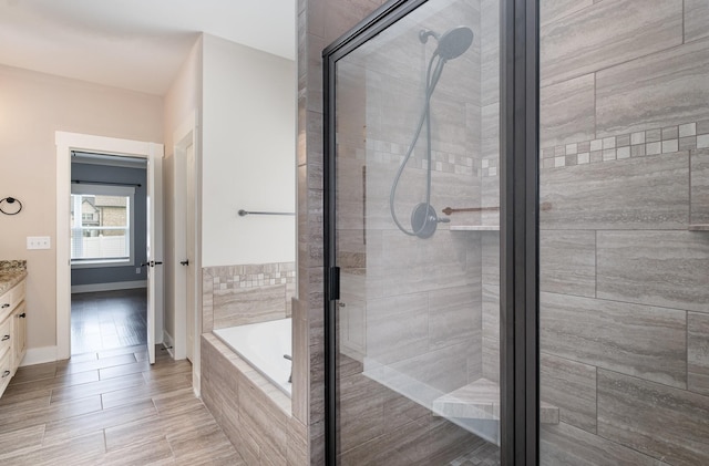 1130 Escalade Ct, Lascassas, TN 37085 - full bath with vanity, a bath, a stall shower, and baseboards