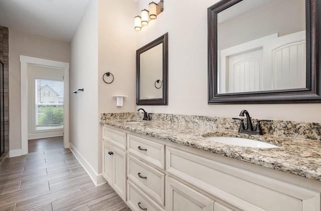 1130 Escalade Ct, Lascassas, TN 37085 - full bathroom featuring double vanity, baseboards, and wood finished floors