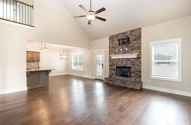 1130 Escalade Ct, Lascassas, TN 37085 - unfurnished living room with ceiling fan, high vaulted ceiling, dark wood finished floors, baseboards, and a fireplace