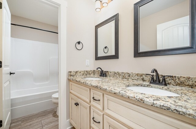 1130 Escalade Ct, Lascassas, TN 37085 - full bathroom with toilet, double vanity, and shower / tub combination