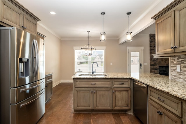1130 Escalade Ct, Lascassas, TN 37085 - kitchen with stainless steel appliances, a sink, a peninsula, dark wood-style flooring, and crown molding