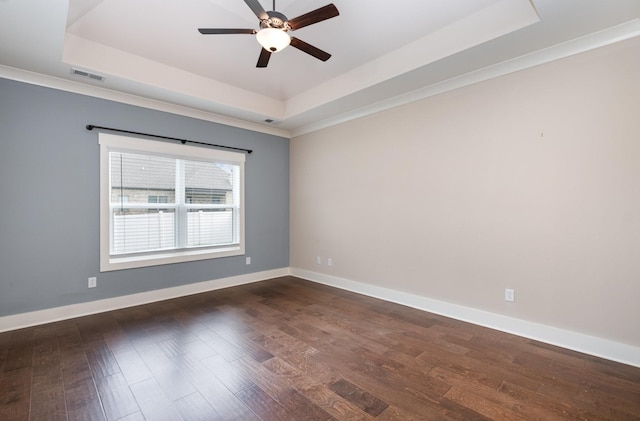 1130 Escalade Ct, Lascassas, TN 37085 - spare room featuring a tray ceiling, ceiling fan, dark wood-type flooring, baseboards, and crown molding