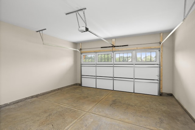 5971 Hunt Valley Dr, Spring Hill, TN 37174 - garage with a garage door opener and baseboards