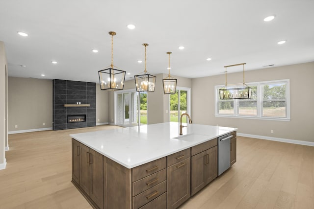 5971 Hunt Valley Dr, Spring Hill, TN 37174 - kitchen with light wood-style floors, dishwasher, a center island with sink, decorative light fixtures, and recessed lighting