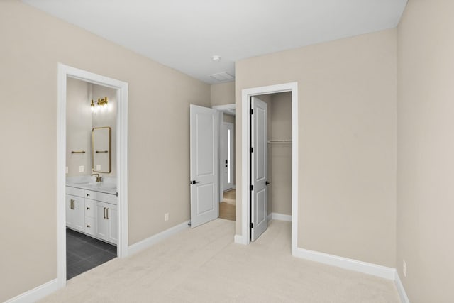 5971 Hunt Valley Dr, Spring Hill, TN 37174 - unfurnished bedroom featuring carpet flooring, a spacious closet, and ensuite bath