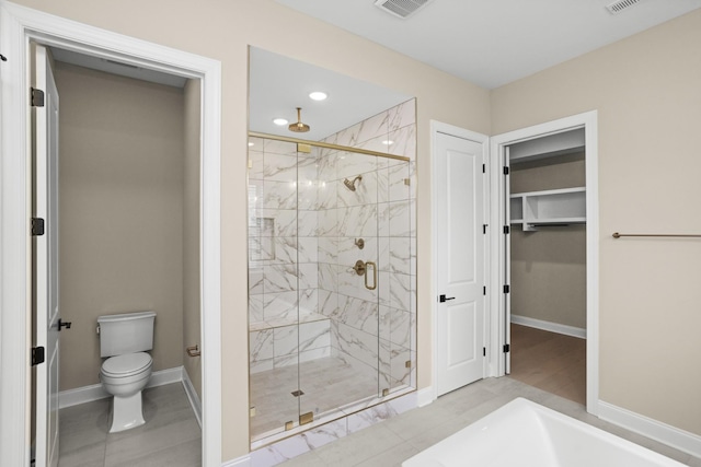 5971 Hunt Valley Dr, Spring Hill, TN 37174 - bathroom featuring a stall shower, a spacious closet, and recessed lighting