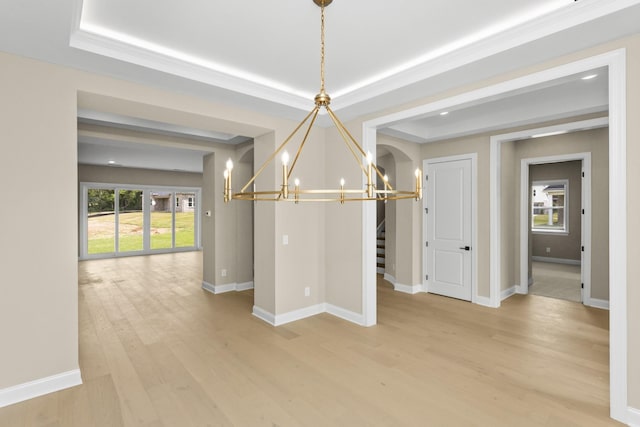 5971 Hunt Valley Dr, Spring Hill, TN 37174 - unfurnished dining area featuring a chandelier, a tray ceiling, light wood-style floors, and stairs