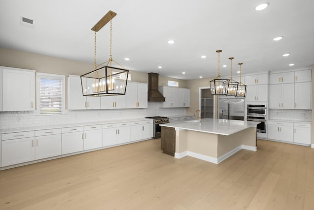 5971 Hunt Valley Dr, Spring Hill, TN 37174 - kitchen with stainless steel appliances, a chandelier, custom exhaust hood, tasteful backsplash, and recessed lighting