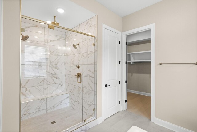 5971 Hunt Valley Dr, Spring Hill, TN 37174 - full bath featuring a marble finish shower, a walk in closet, and recessed lighting