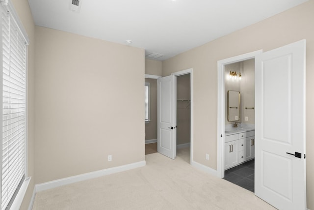 5971 Hunt Valley Dr, Spring Hill, TN 37174 - unfurnished bedroom featuring carpet flooring, a walk in closet, and ensuite bathroom