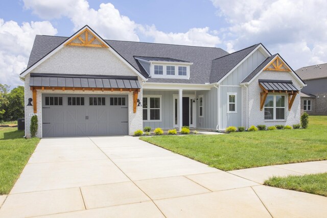 5971 Hunt Valley Dr, Spring Hill, TN 37174 - modern inspired farmhouse with board and batten siding, roof with shingles, driveway, a garage, and a front lawn