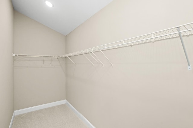 5971 Hunt Valley Dr, Spring Hill, TN 37174 - walk in closet featuring light carpet and lofted ceiling