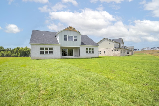 5971 Hunt Valley Dr, Spring Hill, TN 37174 - back of property with board and batten siding and a lawn