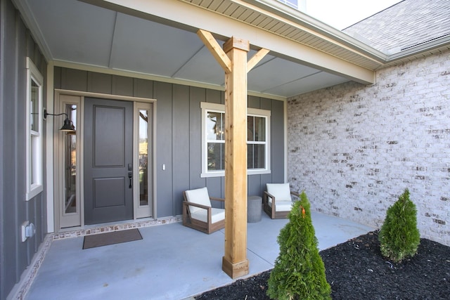5965 Hunt Valley Dr, Spring Hill, TN 37174 - property entrance with board and batten siding and a shingled roof