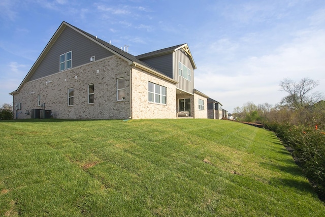 5965 Hunt Valley Dr, Spring Hill, TN 37174 - view of side of home featuring brick siding, a yard, and central air condition unit