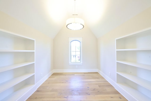 1266 Potter Ln, Gallatin, TN 37066 - spare room with built in features, baseboards, vaulted ceiling, and wood finished floors