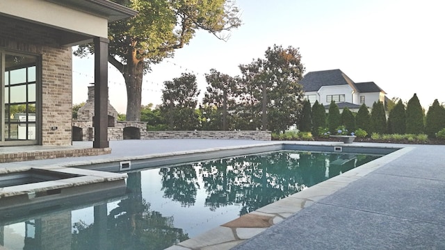 1266 Potter Ln, Gallatin, TN 37066 - view of pool with a patio area, a pool with connected hot tub, and a fireplace