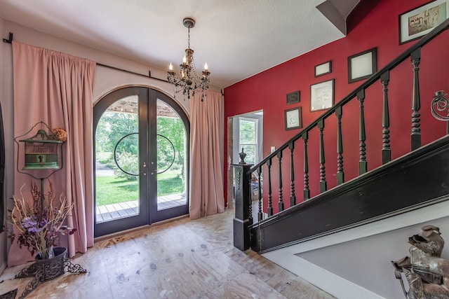3396 Unionville Rd, Halls, TN 38040 - foyer featuring french doors, a chandelier, and stairs