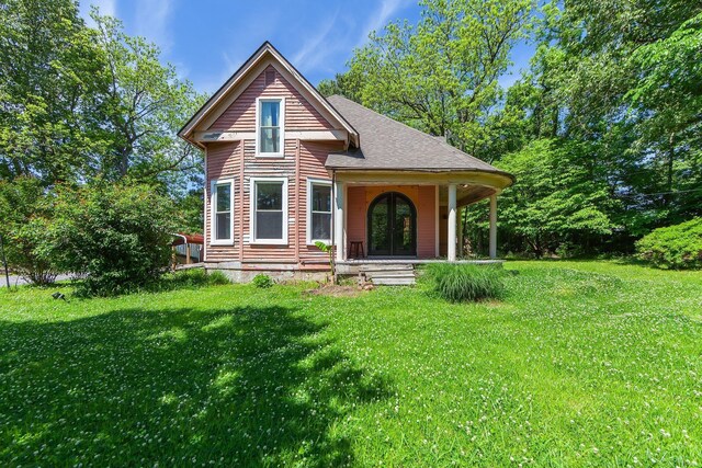 3396 Unionville Rd, Halls, TN 38040 - victorian home featuring a front yard, french doors, and roof with shingles
