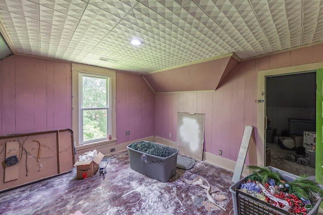 3396 Unionville Rd, Halls, TN 38040 - additional living space with vaulted ceiling, baseboards, and wood walls