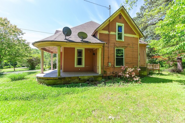 3396 Unionville Rd, Halls, TN 38040 - view of front facade featuring a front lawn, covered porch, and a shingled roof
