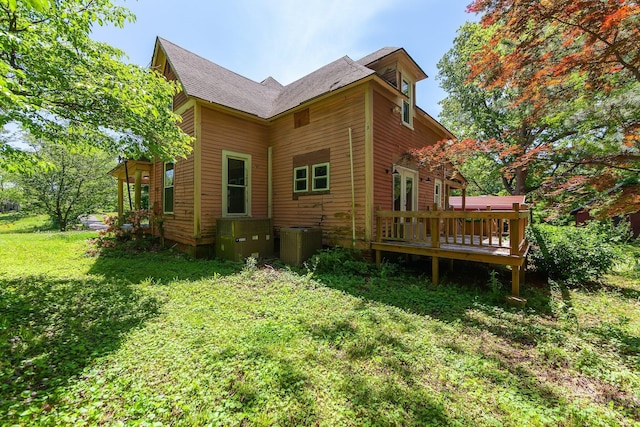 3396 Unionville Rd, Halls, TN 38040 - view of property exterior with a wooden deck, central AC unit, a yard, and a shingled roof