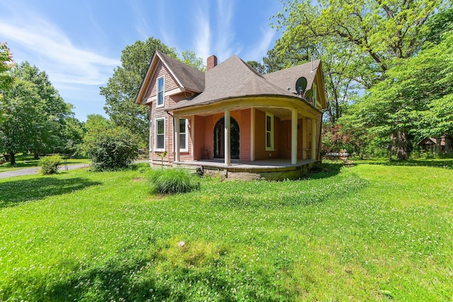3396 Unionville Rd, Halls, TN 38040 - view of front facade featuring a chimney, a front yard, and covered porch