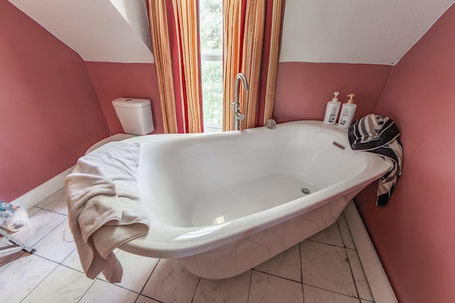 3396 Unionville Rd, Halls, TN 38040 - bathroom with a freestanding bath and marble look tile flooring