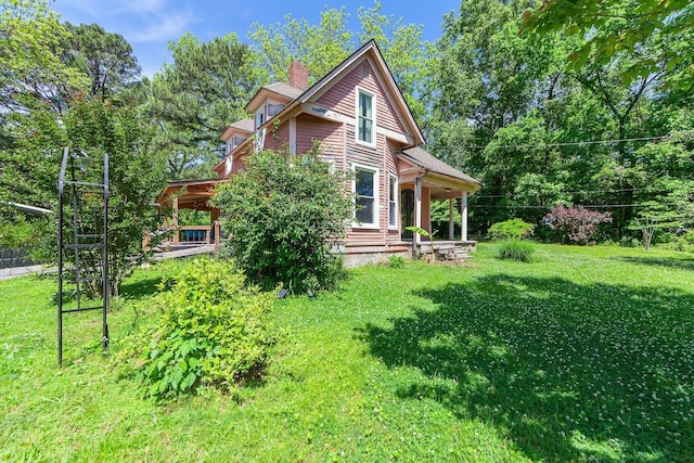 3396 Unionville Rd, Halls, TN 38040 - view of home's exterior with a lawn and a chimney