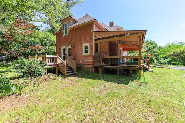 3396 Unionville Rd, Halls, TN 38040 - rear view of house with french doors, a wooden deck, a lawn, and a chimney