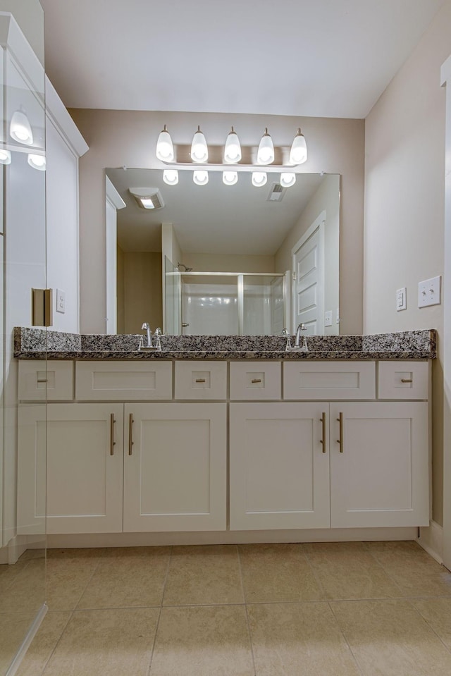 3010 Coriander Dr, Spring Hill, TN 37174 - full bathroom featuring vanity, a stall shower, and tile patterned flooring