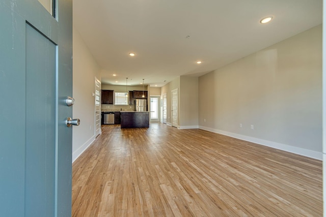 3010 Coriander Dr, Spring Hill, TN 37174 - unfurnished living room with light wood finished floors, baseboards, and recessed lighting