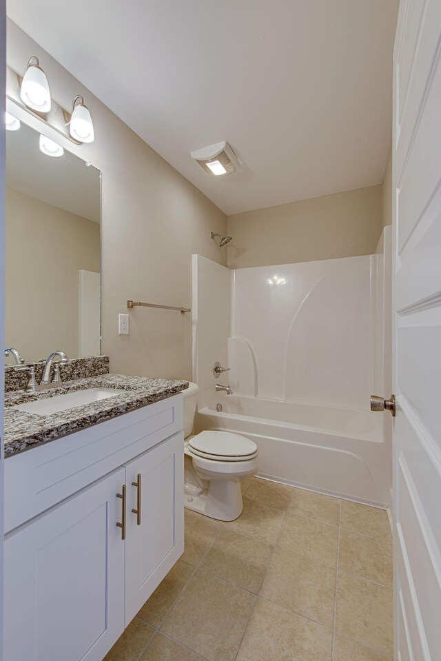 3010 Coriander Dr, Spring Hill, TN 37174 - bathroom featuring vanity, washtub / shower combination, tile patterned flooring, and toilet