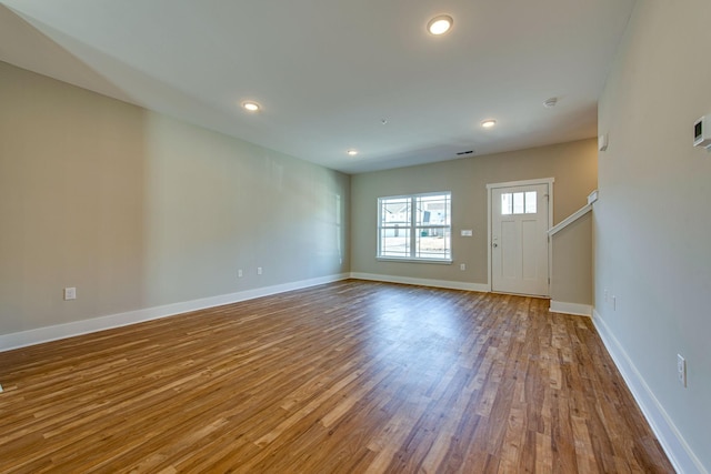 3010 Coriander Dr, Spring Hill, TN 37174 - unfurnished living room with wood finished floors, baseboards, and recessed lighting