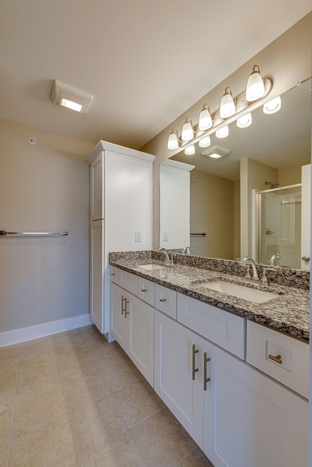 3010 Coriander Dr, Spring Hill, TN 37174 - full bathroom featuring baseboards, double vanity, tile patterned floors, and a shower stall