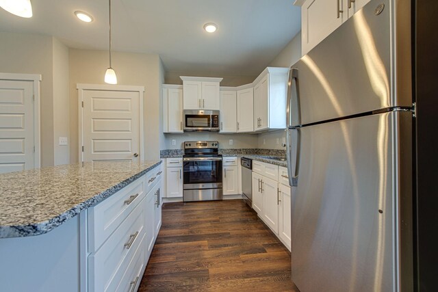 3010 Coriander Dr, Spring Hill, TN 37174 - kitchen with stainless steel appliances, dark wood finished floors, light stone counters, white cabinets, and recessed lighting