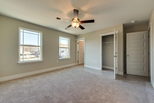 3010 Coriander Dr, Spring Hill, TN 37174 - unfurnished bedroom featuring light carpet, baseboards, and a ceiling fan