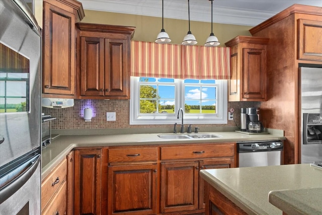 95 Country Ln, Lawrenceburg, TN 38464 - kitchen with appliances with stainless steel finishes, a sink, tasteful backsplash, pendant lighting, and ornamental molding
