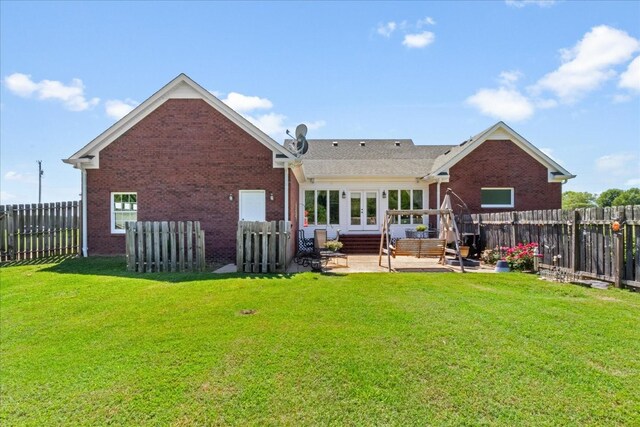 95 Country Ln, Lawrenceburg, TN 38464 - back of property featuring french doors, brick siding, and a patio area