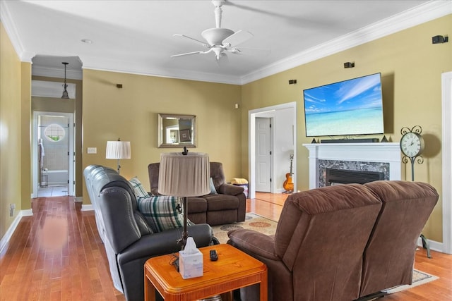95 Country Ln, Lawrenceburg, TN 38464 - living room featuring a ceiling fan, crown molding, wood finished floors, baseboards, and a high end fireplace