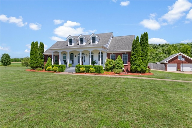 95 Country Ln, Lawrenceburg, TN 38464 - new england style home with covered porch, a garage, and a shingled roof