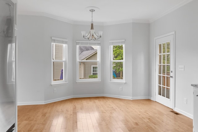 7728 Poplar Ridge Dr, Nashville, TN 37221 - unfurnished dining area with a chandelier, light wood finished floors, ornamental molding, and baseboards