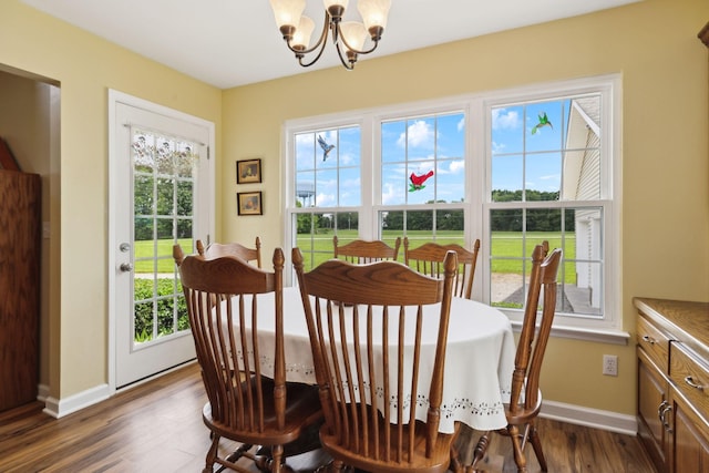 2917 York Rd, Pleasant View, TN 37146 - dining space with a chandelier, dark wood-type flooring, and baseboards