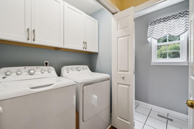 2917 York Rd, Pleasant View, TN 37146 - laundry room with cabinet space, washer and clothes dryer, light tile patterned flooring, and baseboards